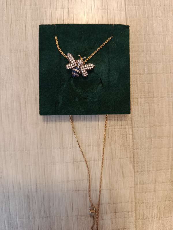 pendant on a chain bee